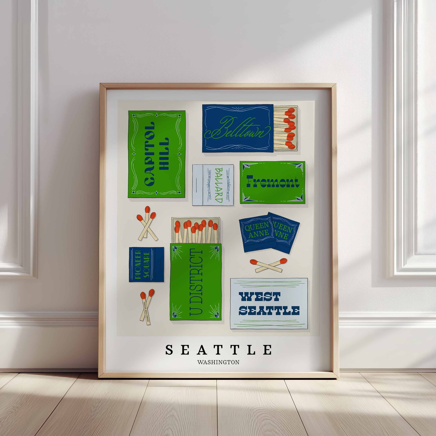 Hand-drawn Seattle matchbox wall art featuring custom lettering in bright blue and green tones