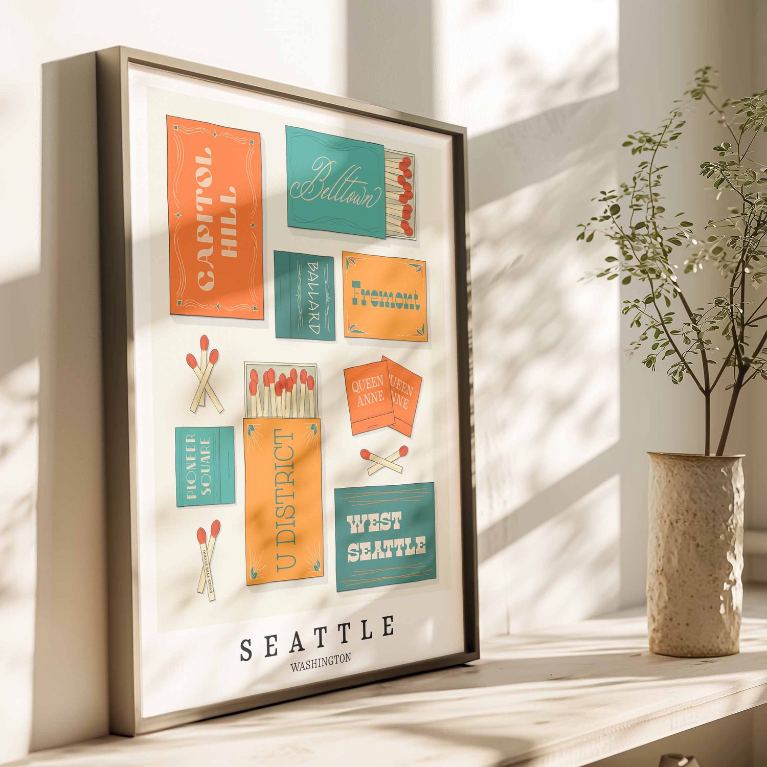 Hand-drawn Seattle matchbox wall art featuring custom lettering in bright blue and orange tones