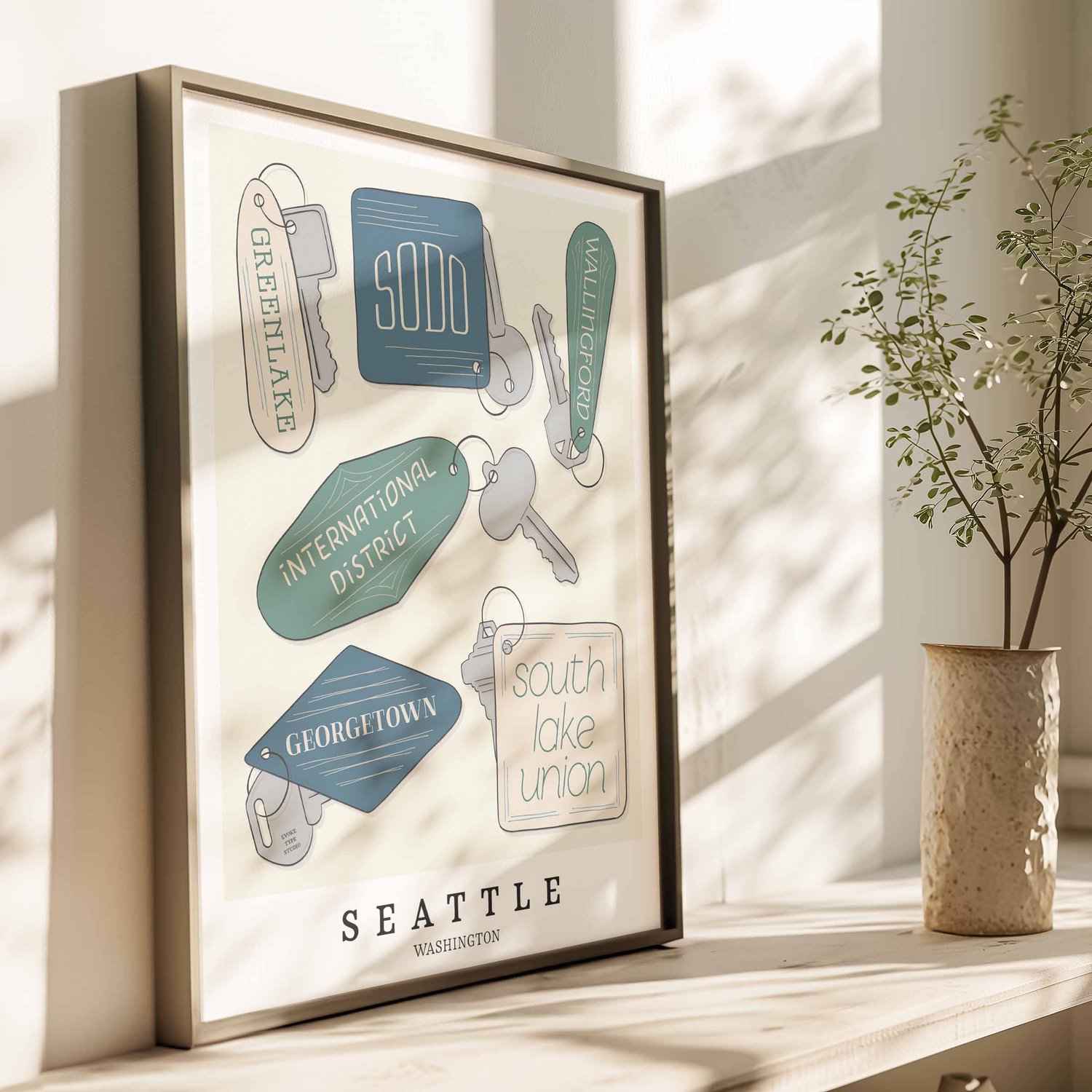 Hand-drawn Seattle key fobs wall art featuring custom lettering in blue, green, and beige tones