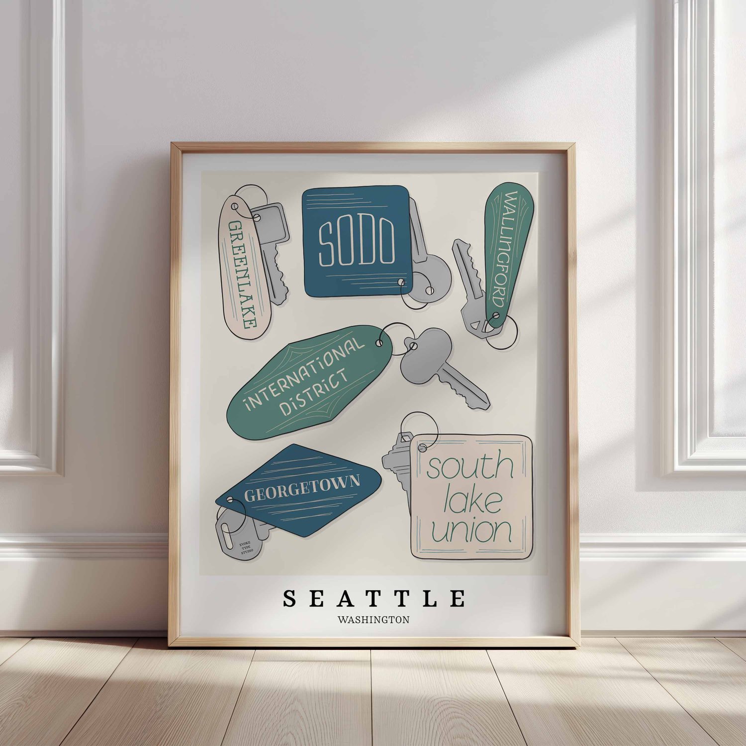 Hand-drawn Seattle key fobs wall art featuring custom lettering in blue, green, and beige tones