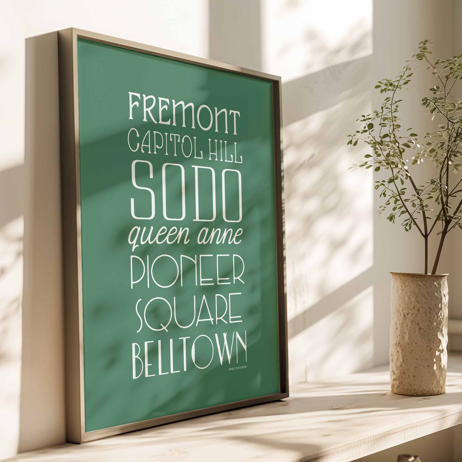Colorful, hand-lettered Seattle neighborhoods type stack art print in green and white for typography lovers