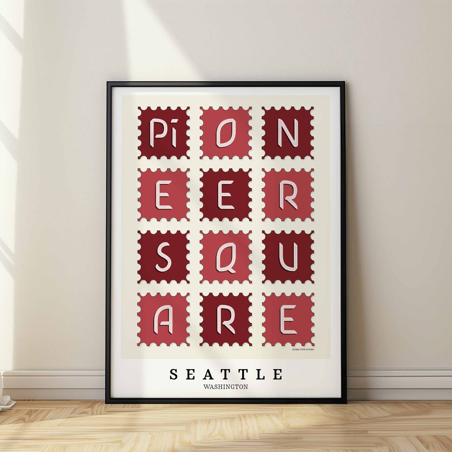 Hand-drawn Pioneer Square wall art in postage stamp style featuring unique lettering in red and white tones