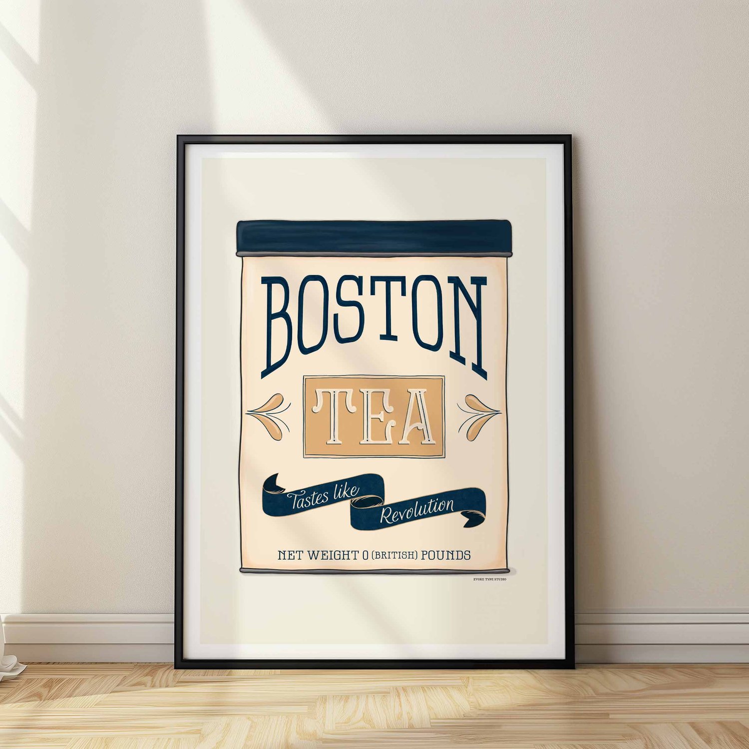 Nautical-style Boston wall art featuring a vintage tea tin design with the phrase ‘Tastes Like Revolution.’