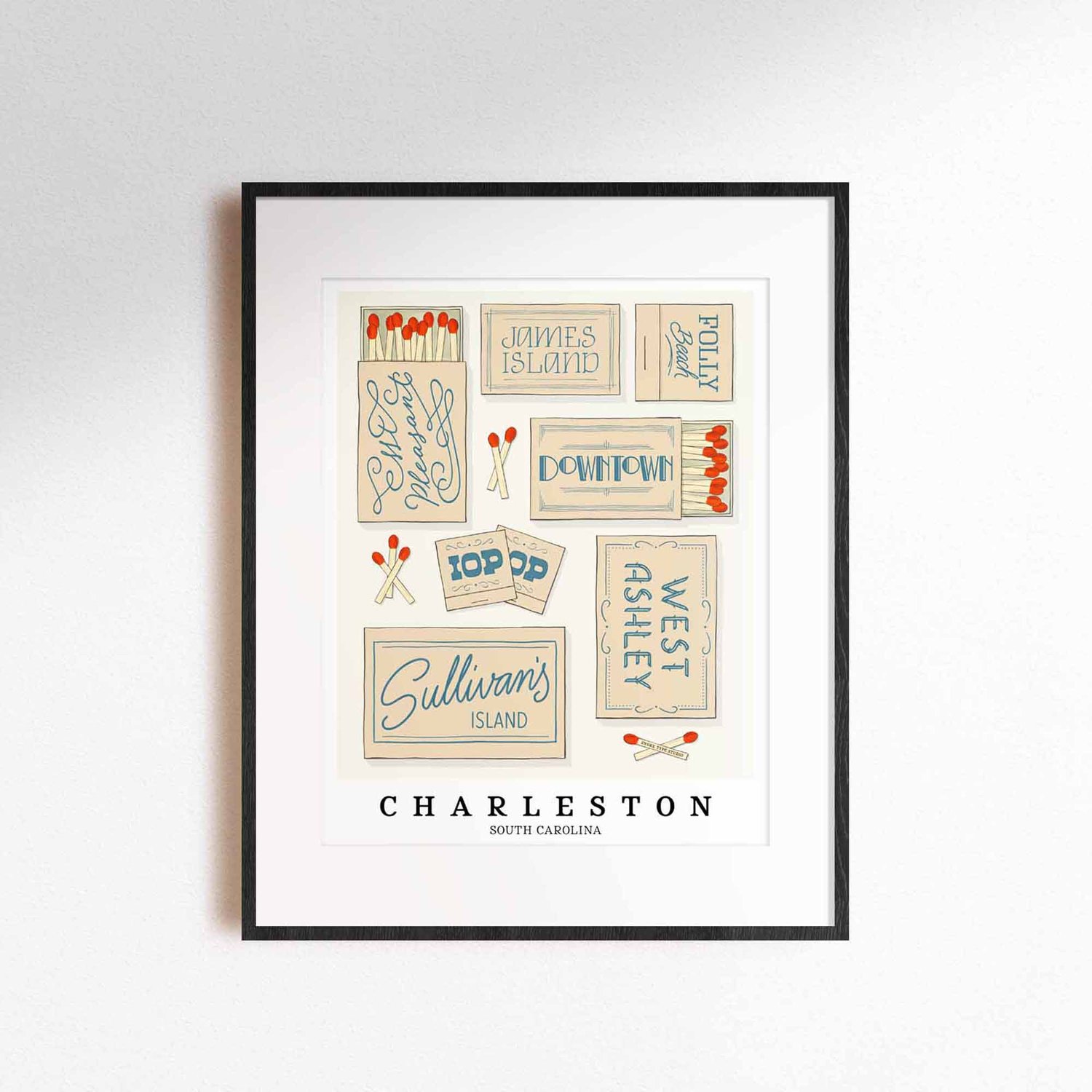 A framed picture of Charleston, South Carolina neighborhoods drawn in various lettering styles on matchboxes. Artwork has a beige and blue color scheme.