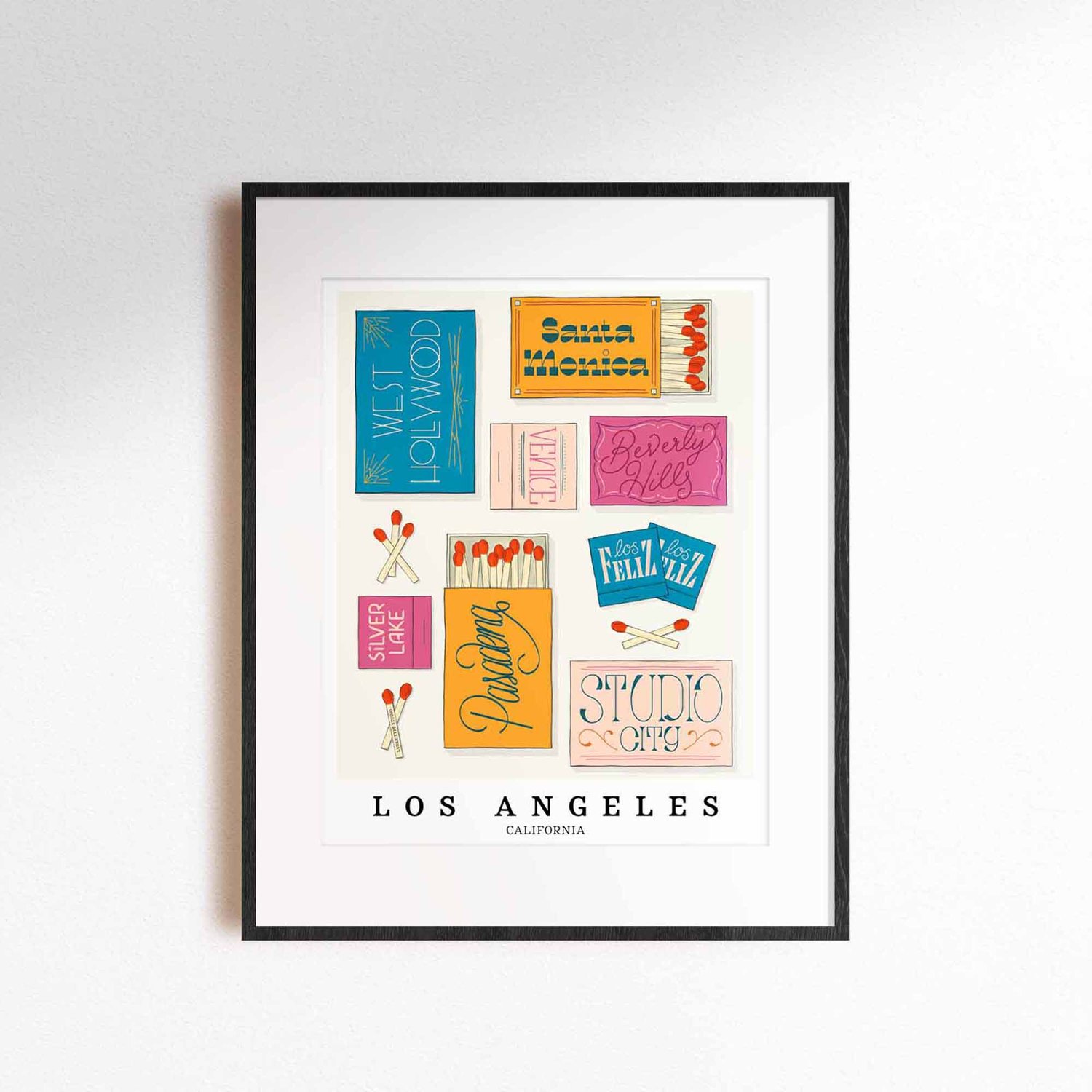 A framed picture of Los Angeles, California neighborhoods drawn in various lettering styles on matchboxes. Artwork has a bold and bright color scheme of vibrant blues, oranges and pinks.