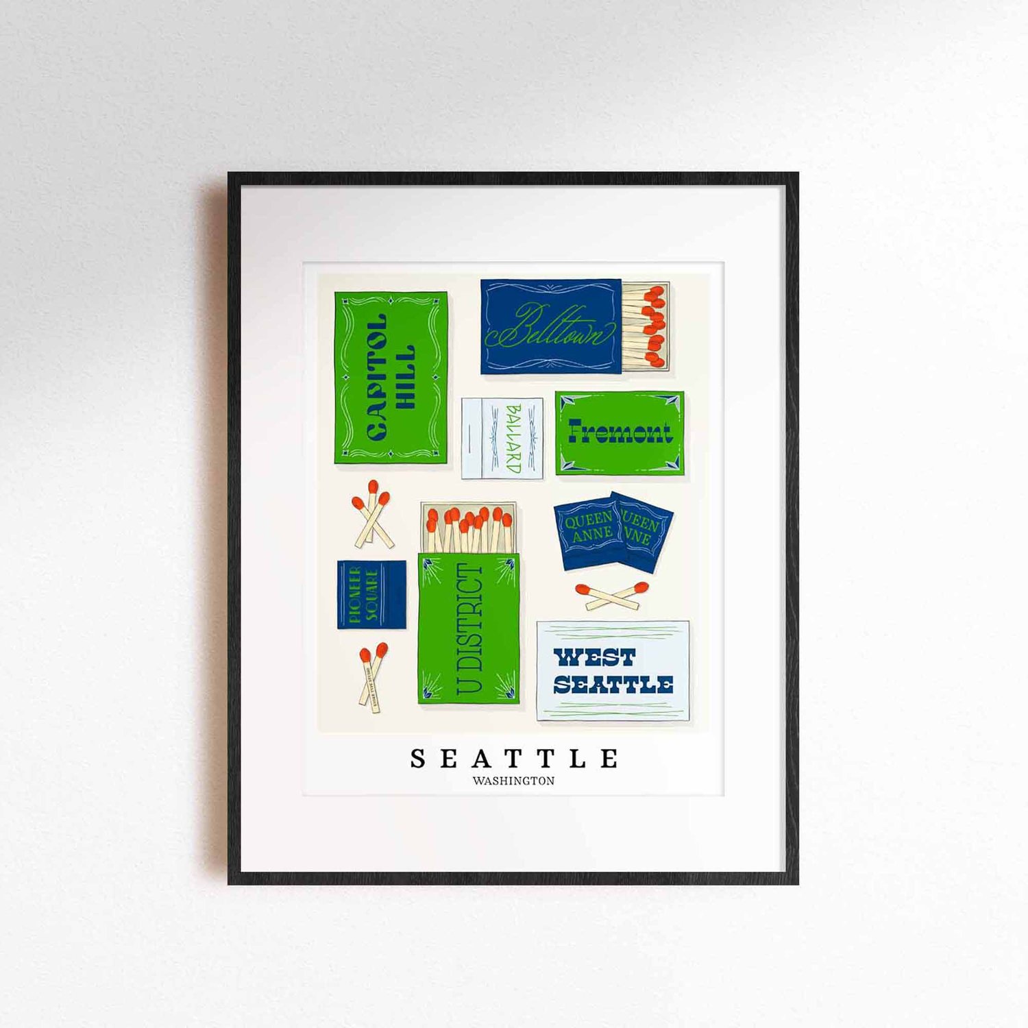 A framed picture of Seattle, Washington neighborhoods drawn in various lettering styles on matchboxes. Artwork has a bright green and blue color scheme