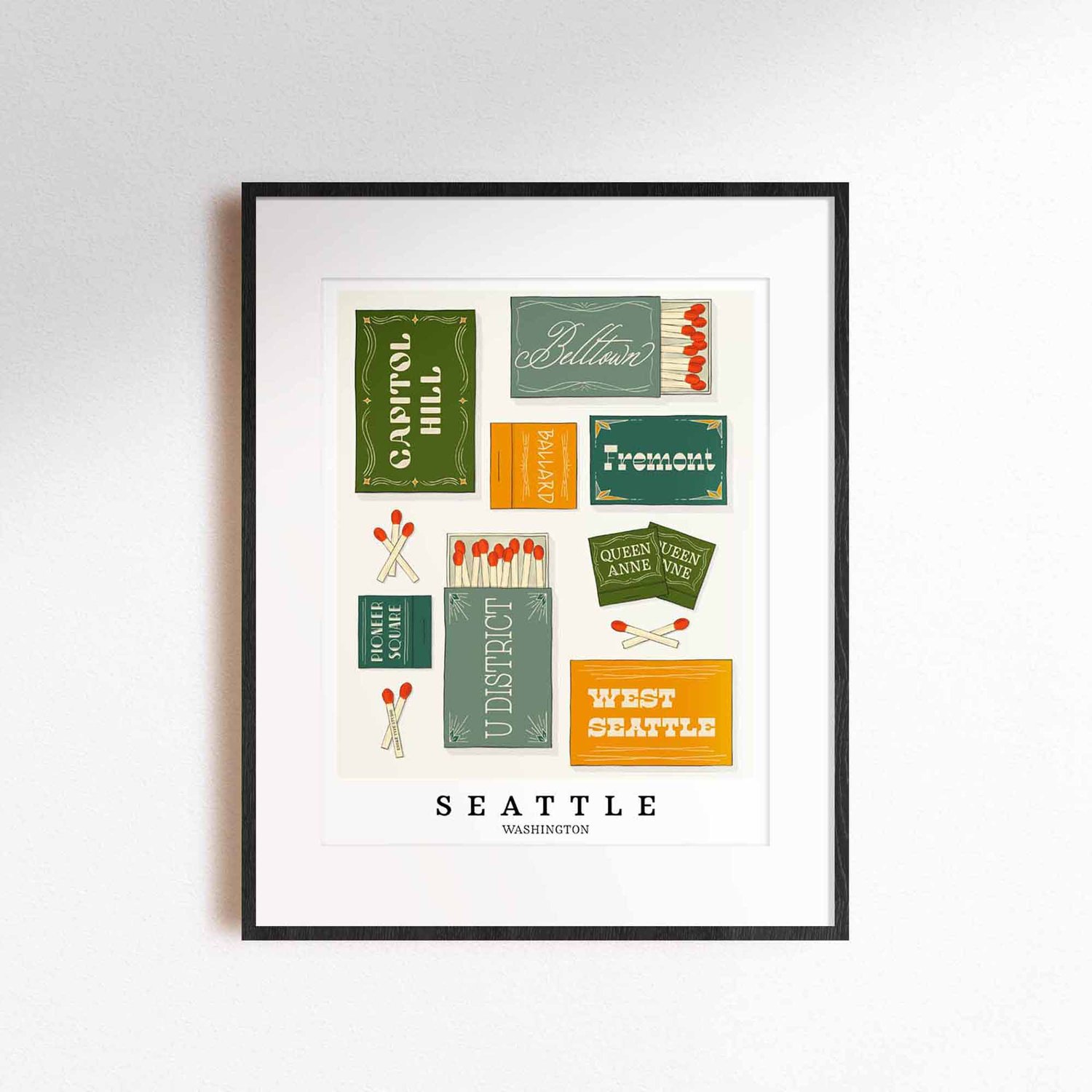 A framed picture of Seattle, Washington neighborhoods drawn in various lettering styles on matchboxes. Artwork has a green, yellow and blue color scheme
