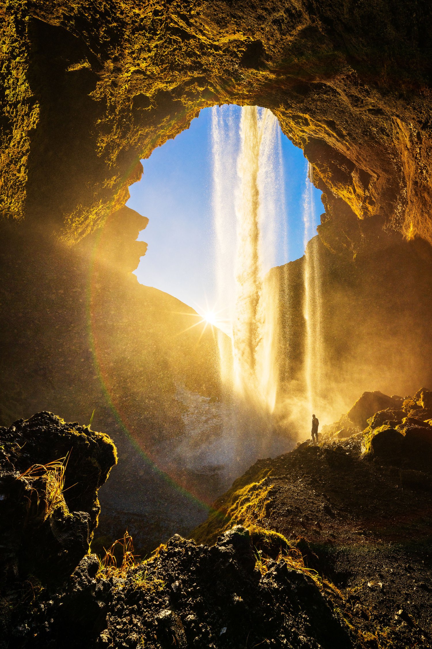 Kvernufoss sunset iceland winter waterfall person backlit water landscape photography