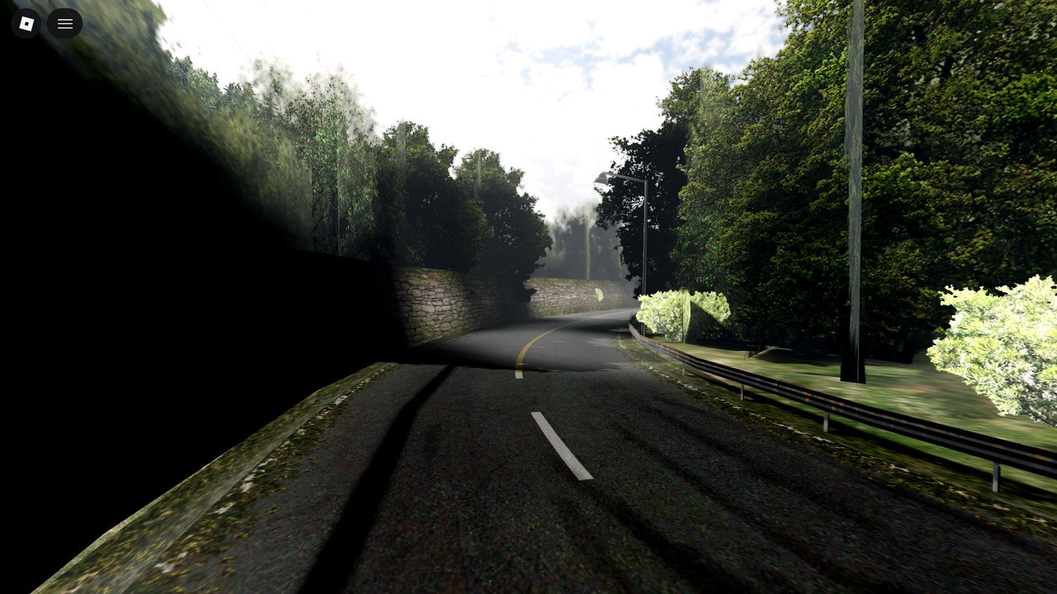 hills and trees surrounding forest road roblox