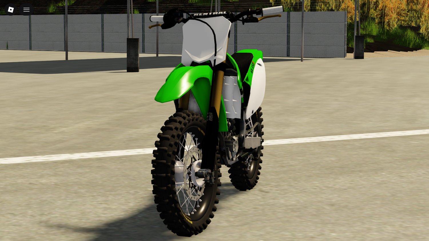 Player riding KX450 on dirt track