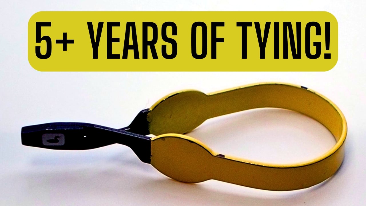 Close-up of Loon Outdoors Ergo Hackle Pliers with yellow base and “5+ Years of Tying!” text.