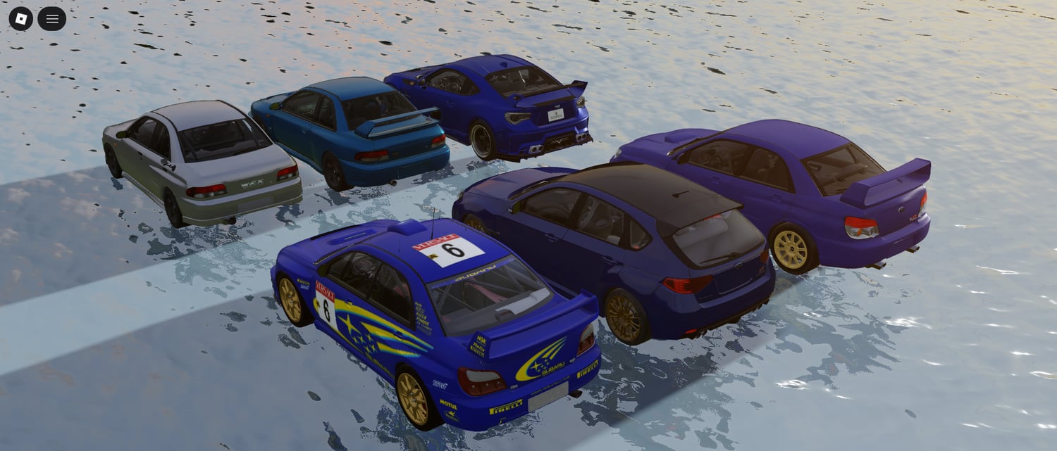 subaru race cars displayed in virtual pit garage