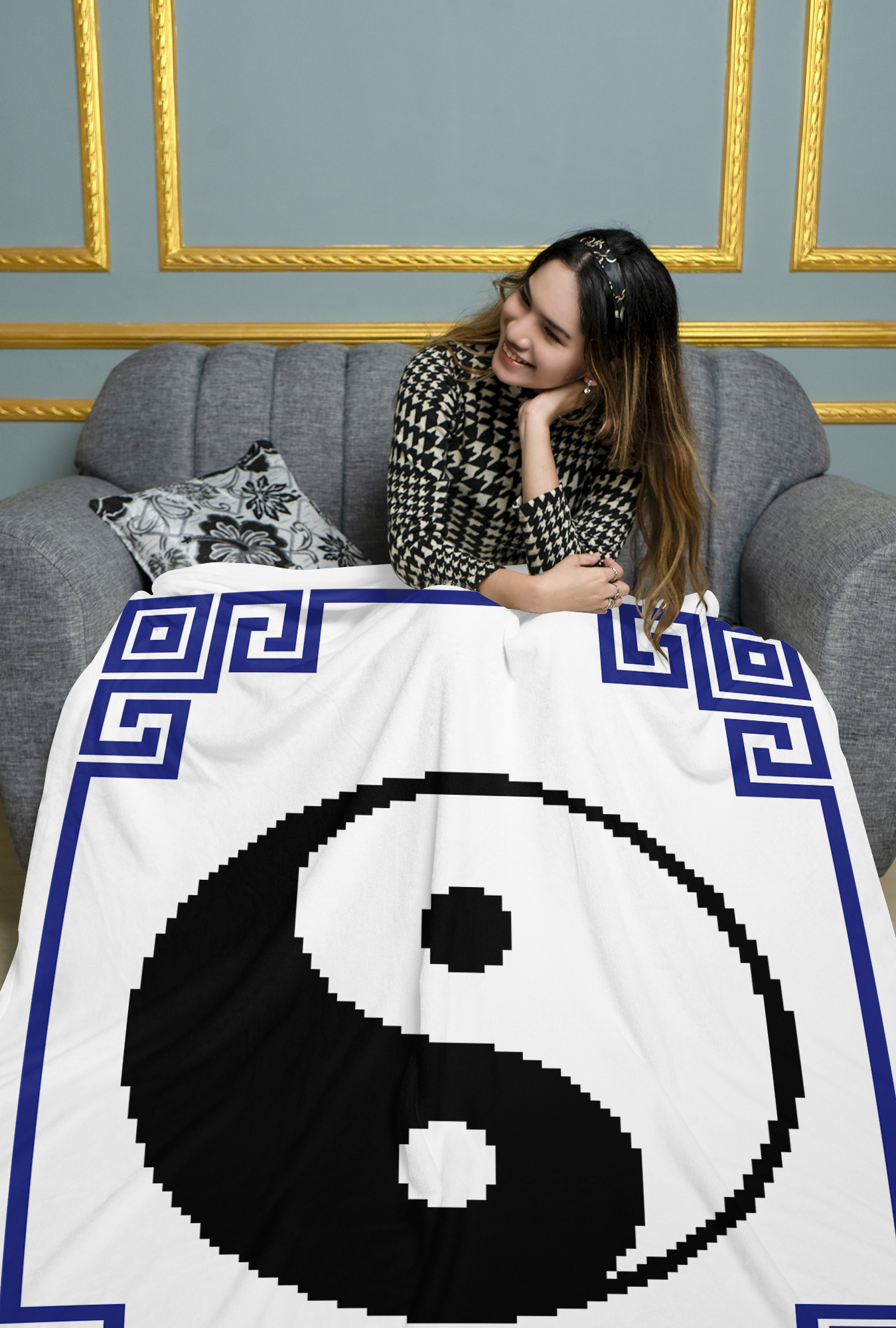 Black and white Yin Yang crochet blanket styled in living room