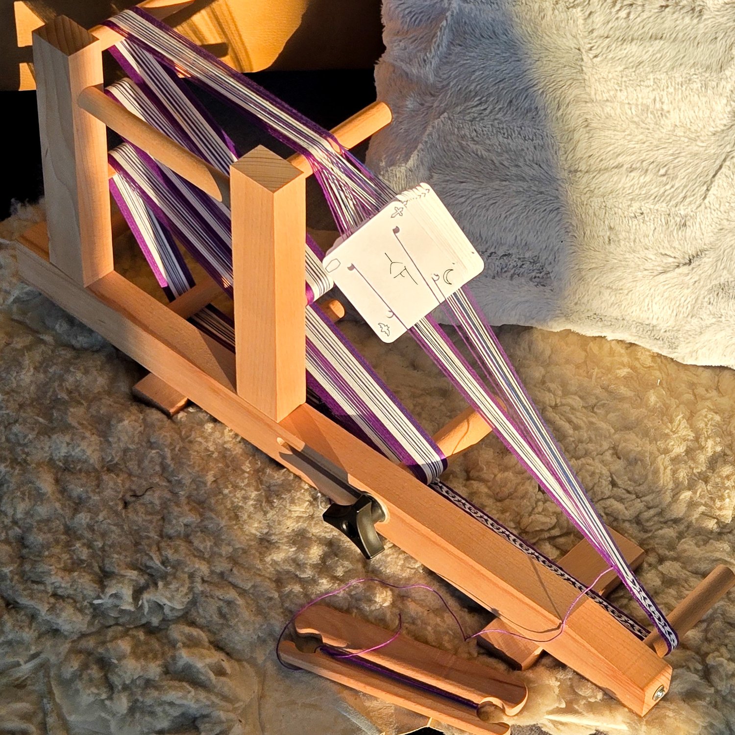 inkle loom with threaded tablet weaving cards