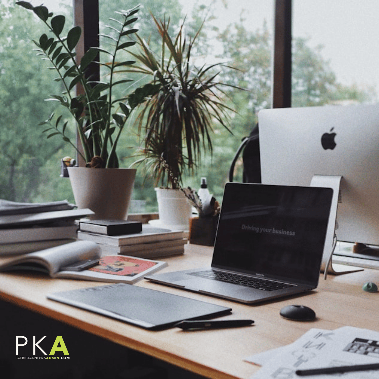 A professional and serene home office desk with a laptop displaying the text 