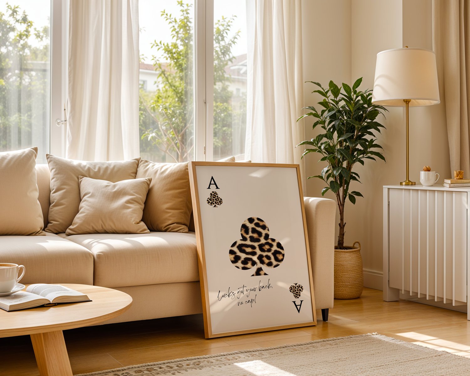 Leopard print playing card wall art poster with quote typography, framed minimalist artwork styled in a modern interior.
