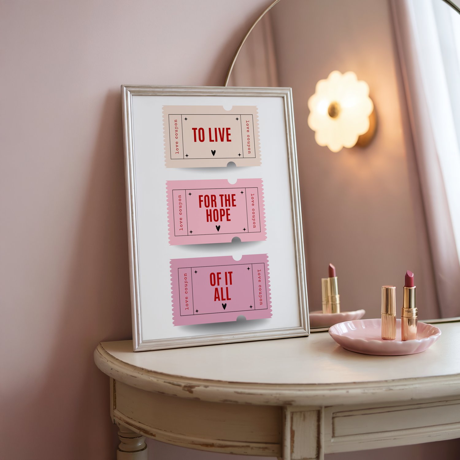 Framed quote wall art poster with stacked typography text displayed in a modern pink-toned interior.