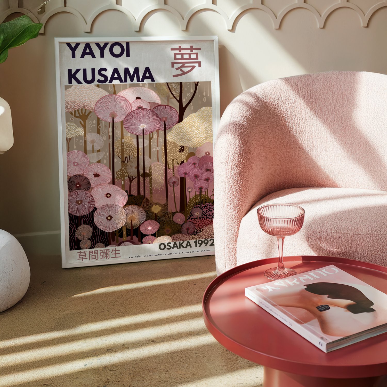 Kusama-inspired abstract wall art poster with floral patterns and Japanese typography, framed in a modern pink-toned interior.