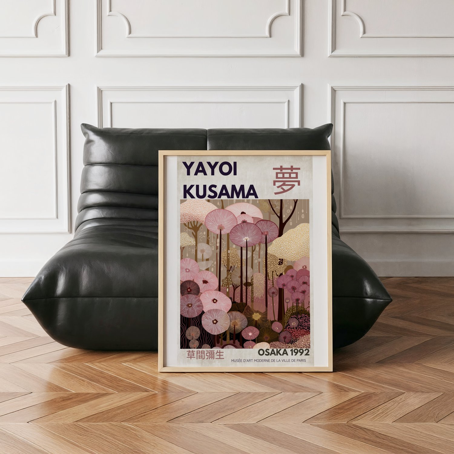 Kusama-inspired abstract wall art poster with floral patterns and Japanese typography, framed in a modern pink-toned interior.