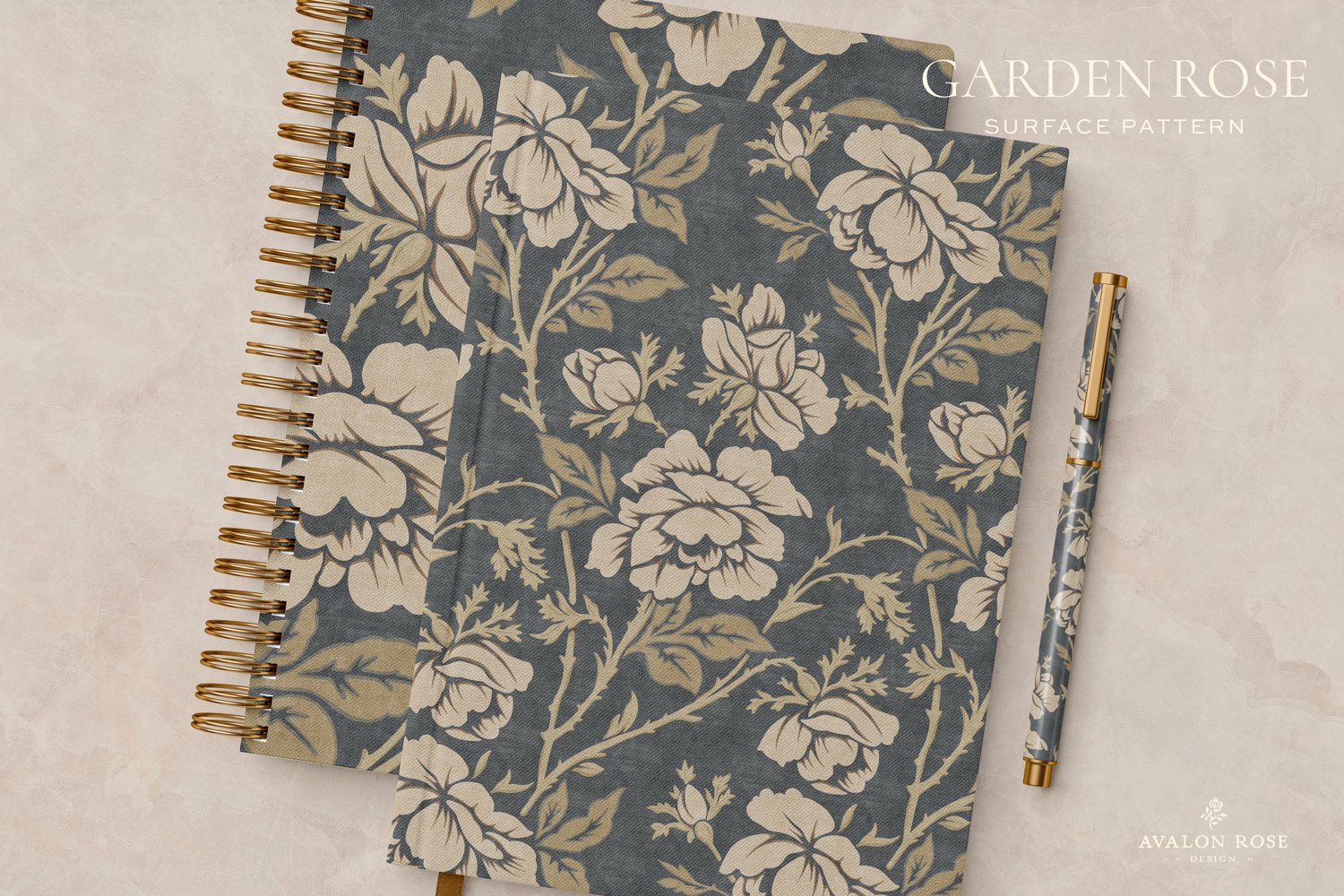 Two notebooks and a pen featuring a vintage rose illustrated pattern design in dark gray and beige