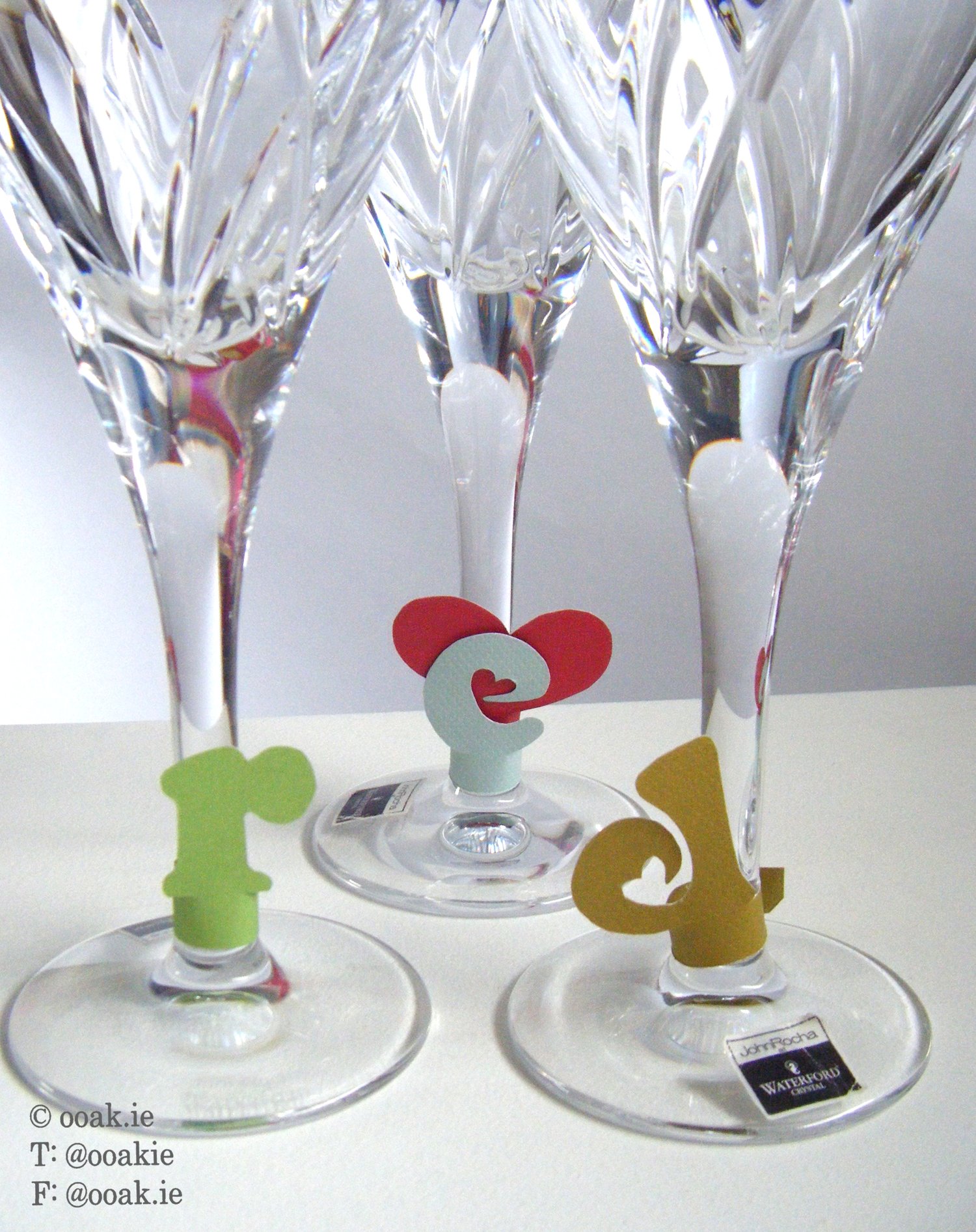 8 printable heart-themed wine glass tags spelling FRIENDS, displayed as DIY drink markers on wine glass stems.