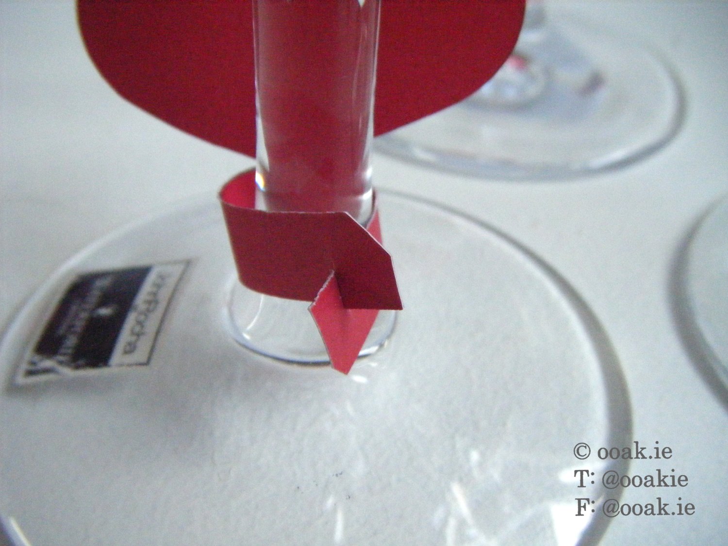 8 printable heart-themed wine glass tags spelling FRIENDS, displayed as DIY drink markers on wine glass stems.