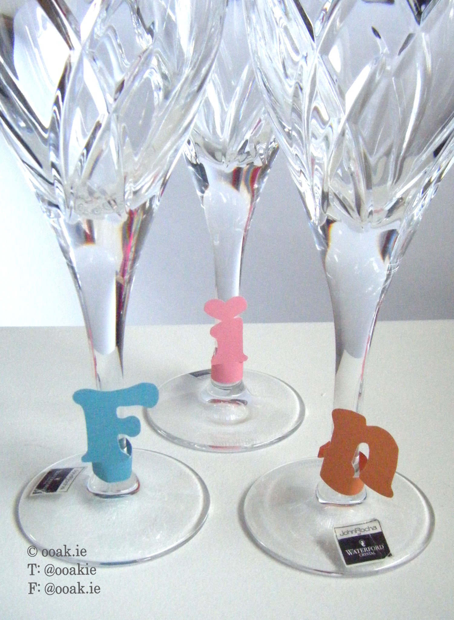 8 printable heart-themed wine glass tags spelling FRIENDS, displayed as DIY drink markers on wine glass stems.