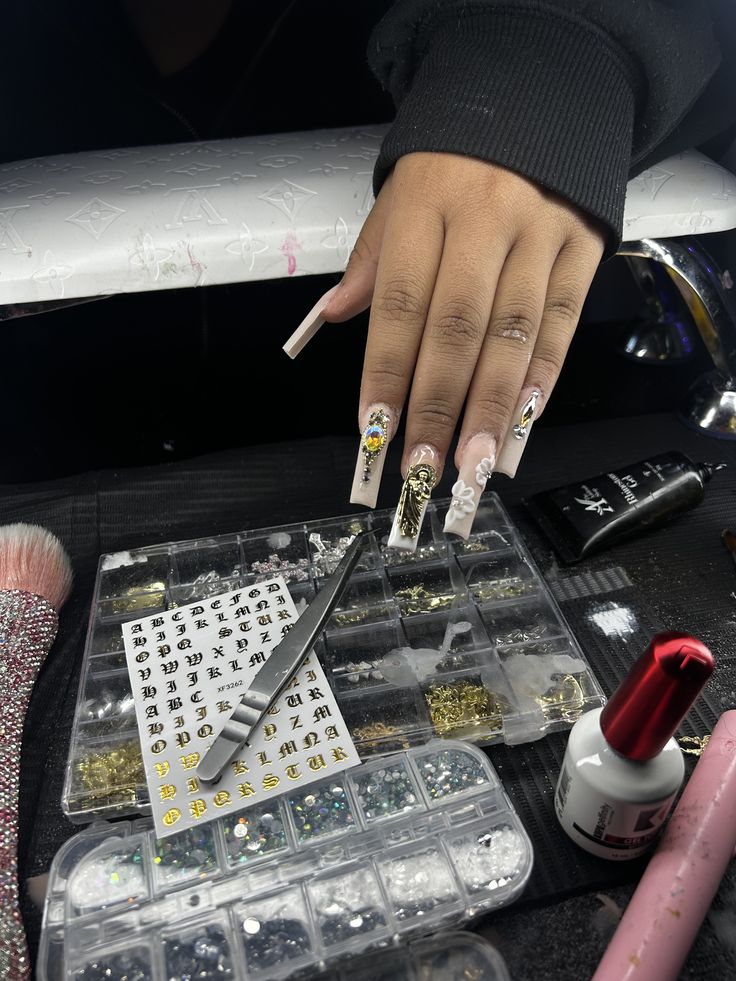 Nail technician carefully applying intricate nail art on a client’s nails in a clean, modern nail studio, showing professional skill and precision.