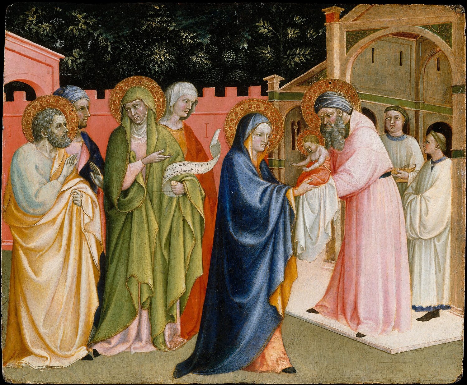 A 15th Century painting of Mary at the entrance to the temple giving the baby Jesus to Simeon to hold. Mary wears a long draped blue cloak. Behind her is Anna and Joseph and two other figures. Simeon wears a pink habit and has some boy attendants behind h