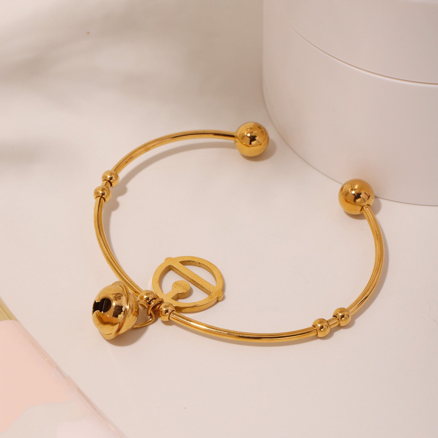 Elegant 18K gold plated bell bracelet in titanium steel