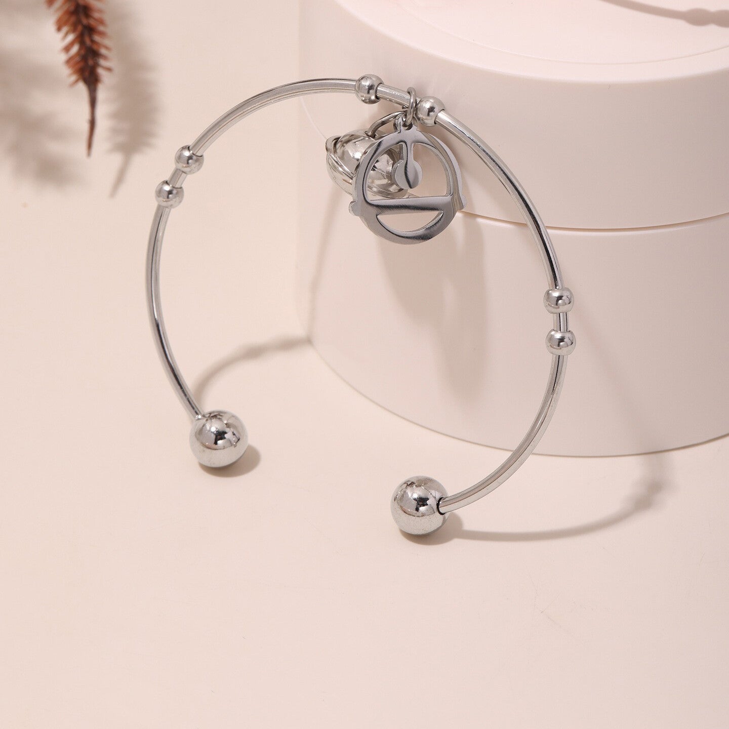 Women’s gold-tone bracelet with unique double bell pendants