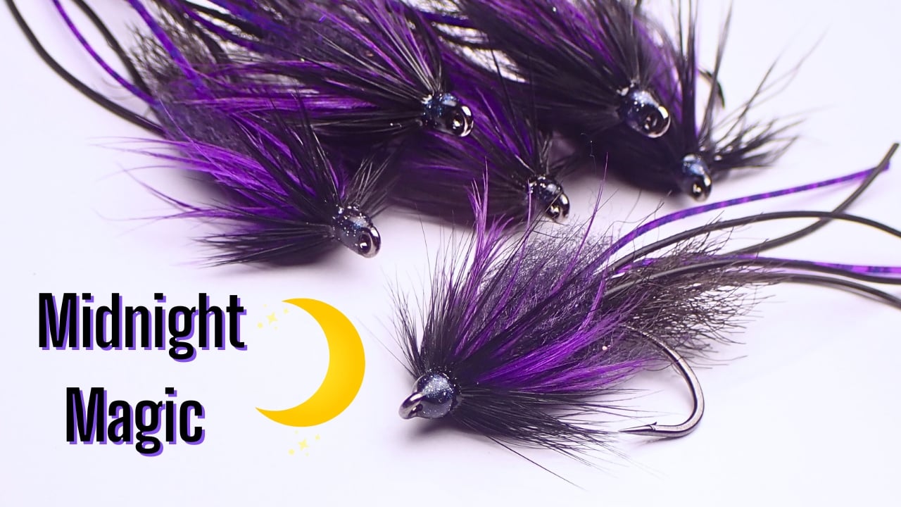 Close-up of J-Lo Bug bass flies in Midnight color, designed by Matt Campbell, The Fly Guy.