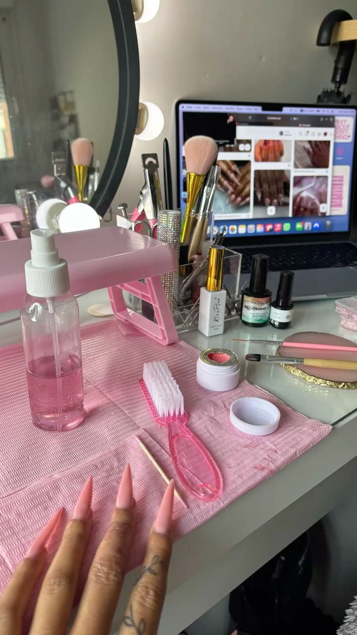 Nail technician professionally consulting a client to manage expectations, illustrating how to handle difficult clients.