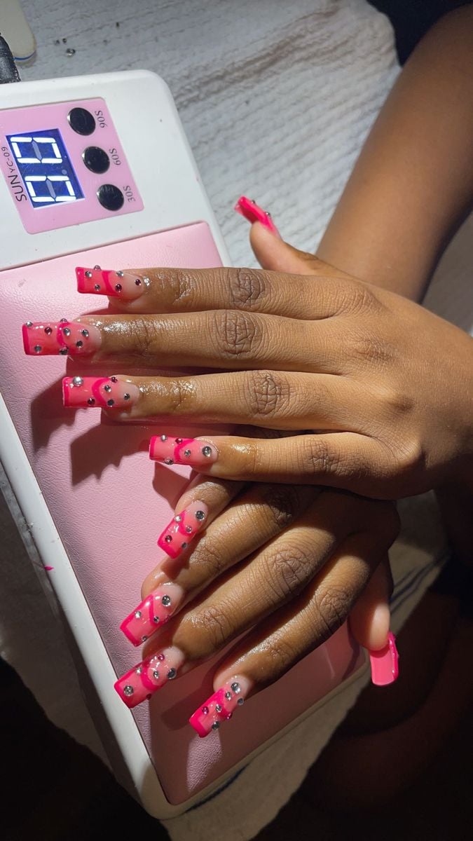 Nail technician consulting with a client to prevent mistakes and improve client satisfaction in a nail business.