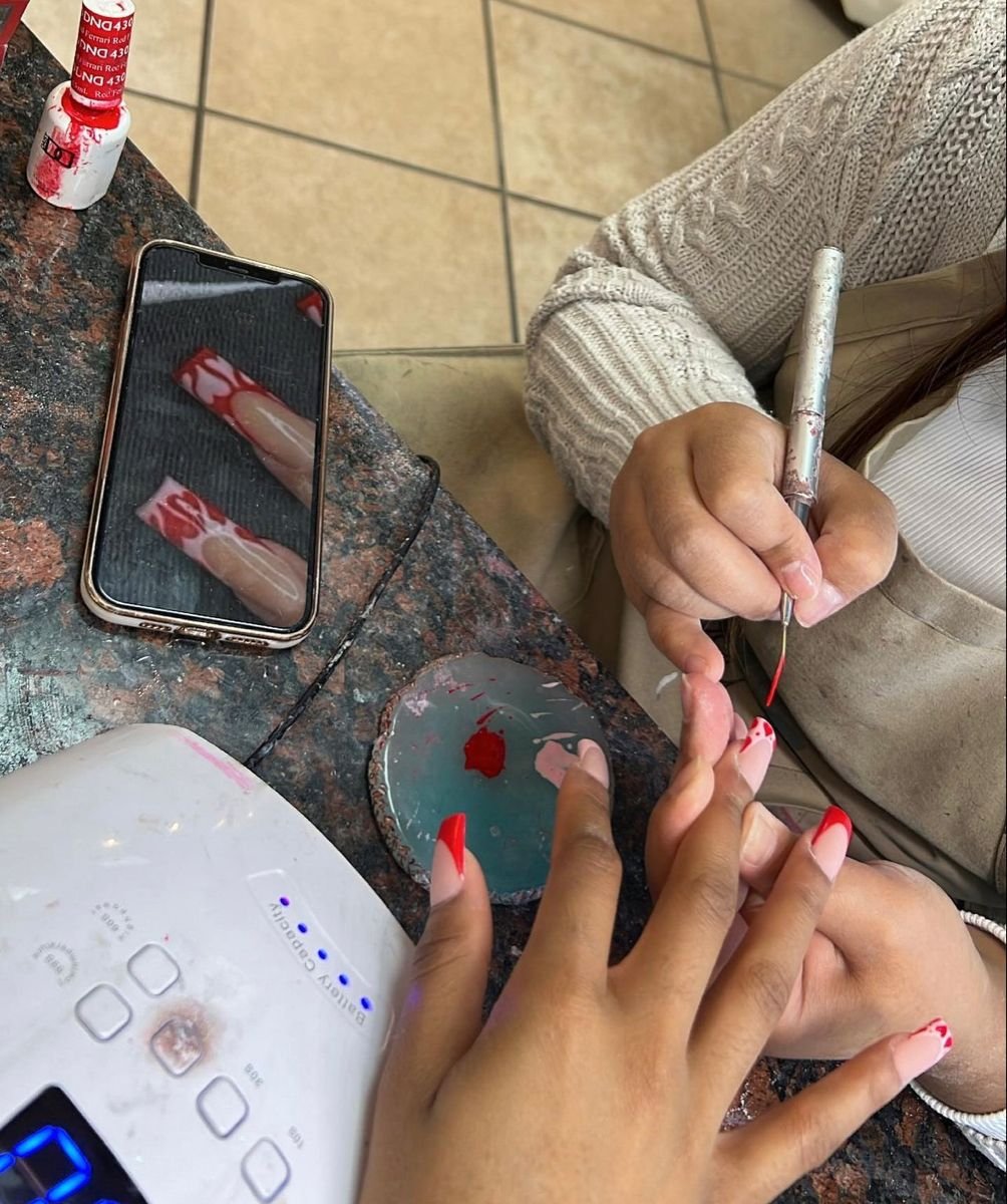 Nail technician marketing a nail business locally to attract clients and grow bookings.