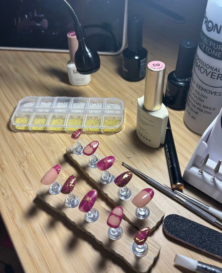 Nail technician analyzing business metrics to improve revenue and grow a nail business.