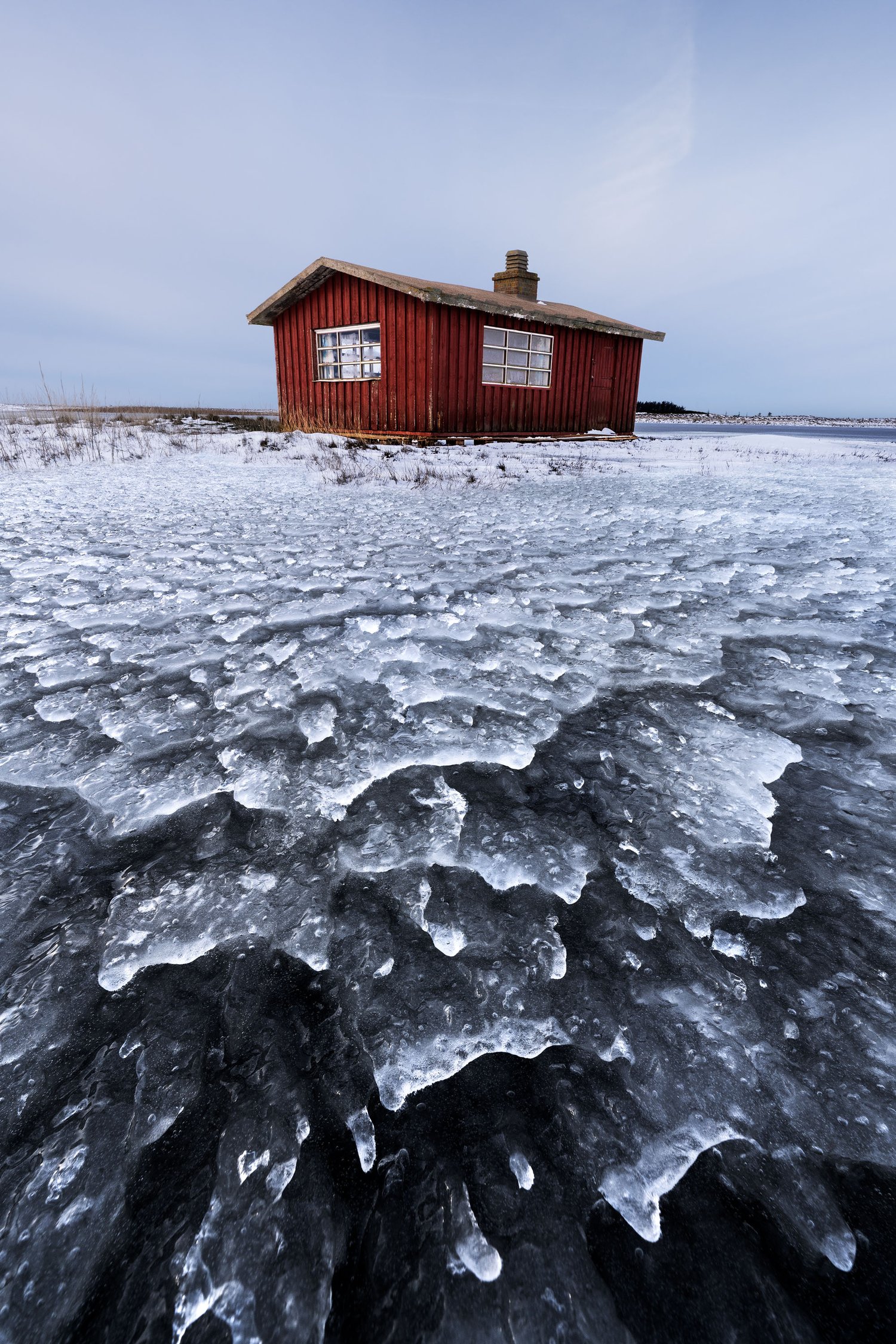 Red hut house ice foreground focus stack winter denmark landscape photography