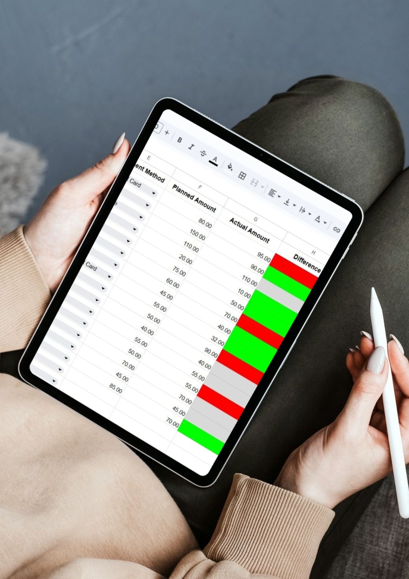 Solo traveler using the Google Sheets travel budget tracker on a tablet with a stylus, showing a clean digital interface for expense management on the go