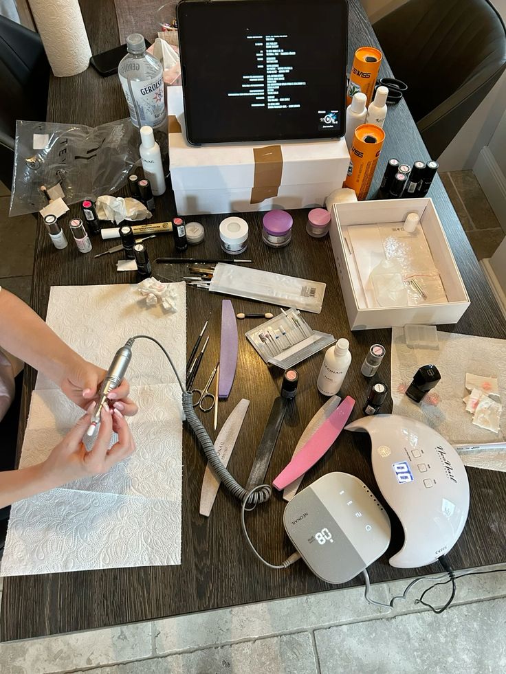 Nail technician showing seasonal nail menu with trendy designs to boost client bookings and nail business revenue.