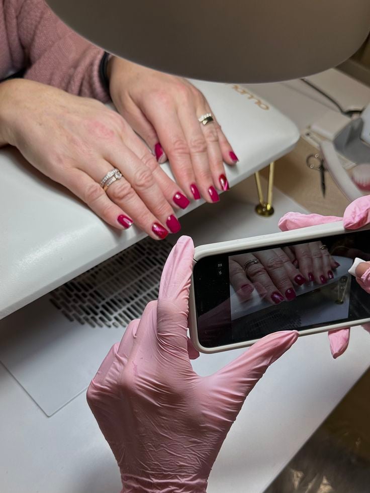 Nail technician following a productive daily routine in a well-organized nail studio to grow their business.