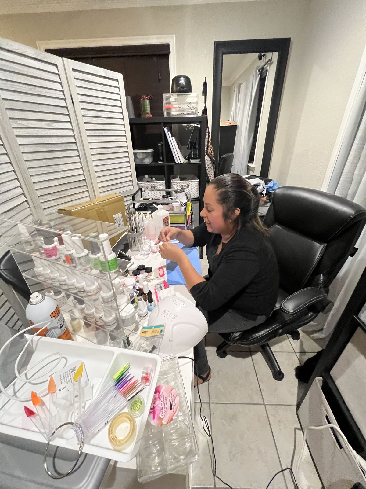 Nail technician introducing a client loyalty program to encourage repeat visits and grow the business.