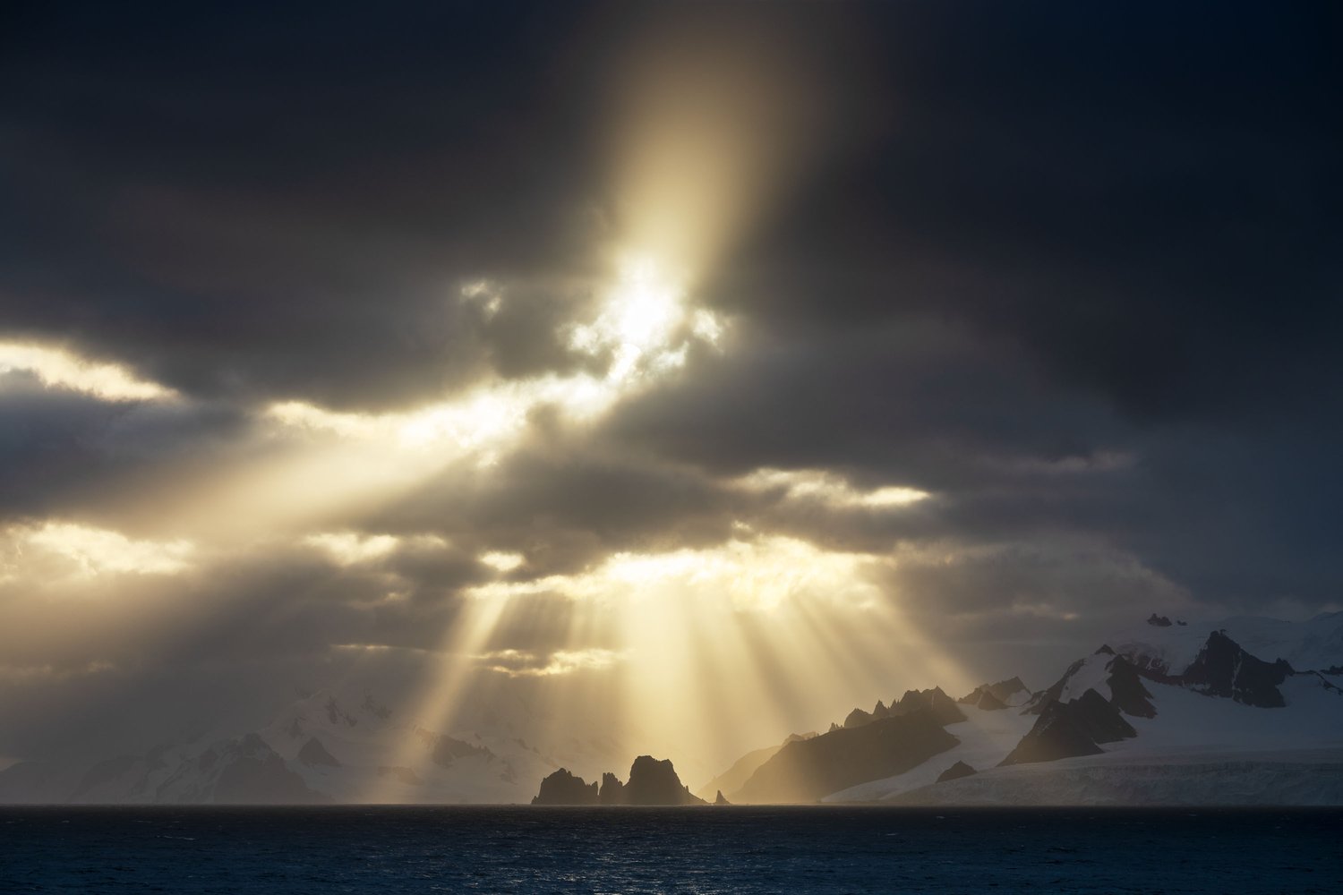 Antarctica sunset sea stack light rays beams seascape landscape photography 2