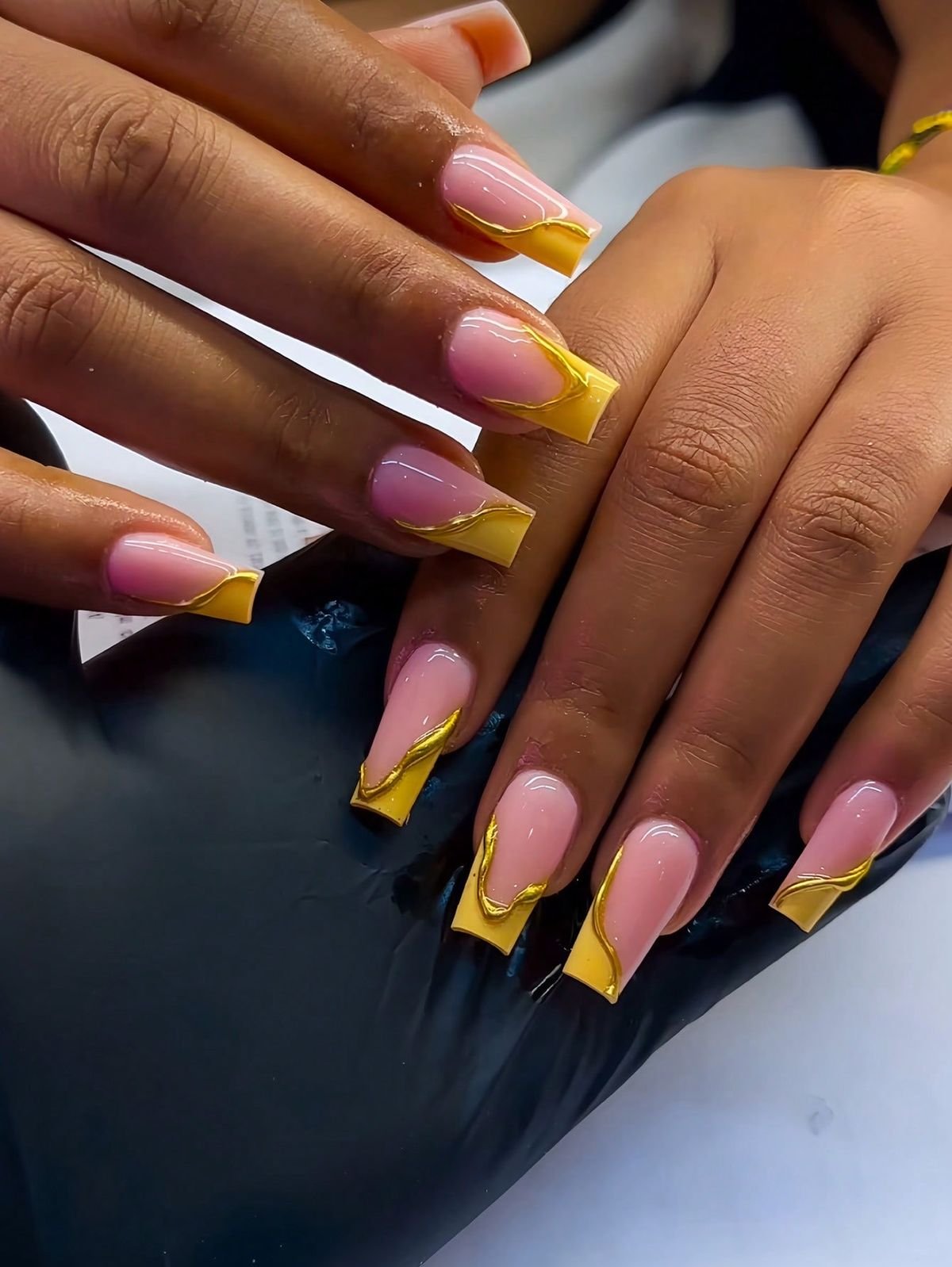 Nail technician improving client retention by creating a personalized and welcoming experience.