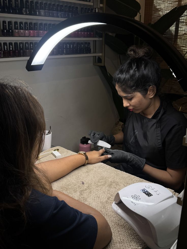 Nail technician upselling nail services professionally to enhance client experience and grow the business.