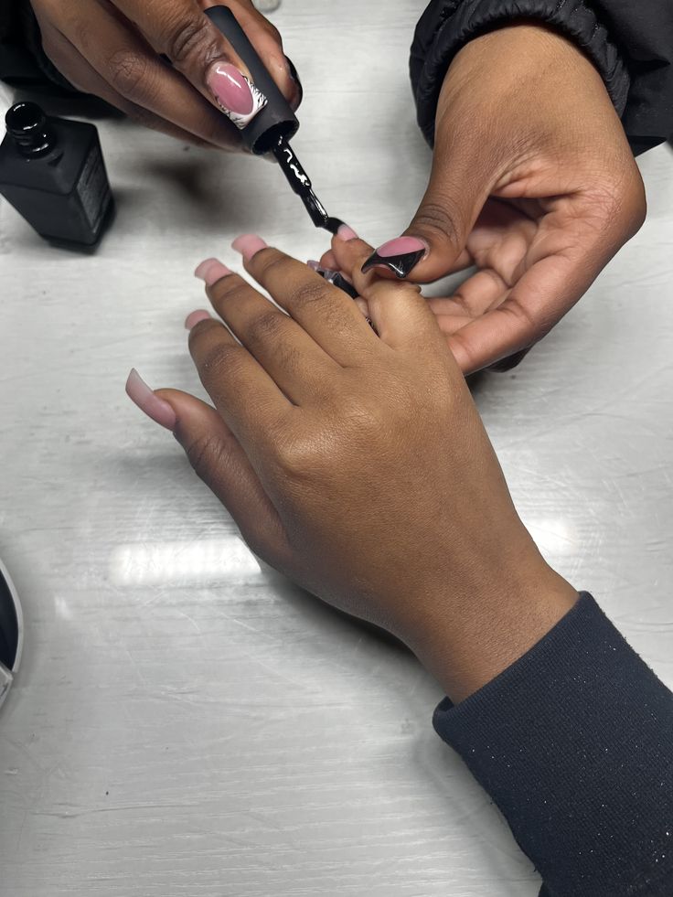 Nail technician setting competitive pricing for services to grow the business and attract clients.