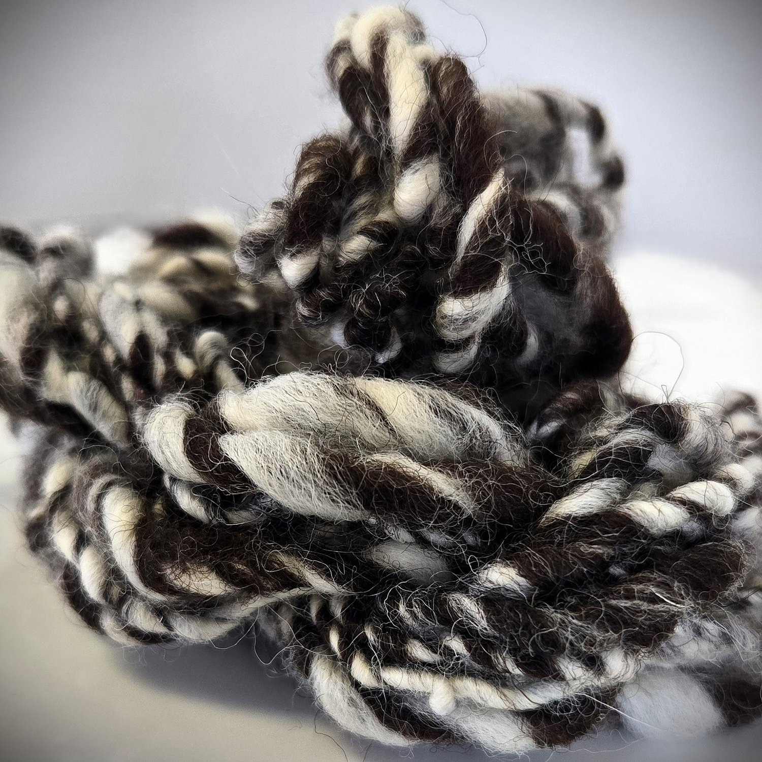 vignette images of brown and white art yarn