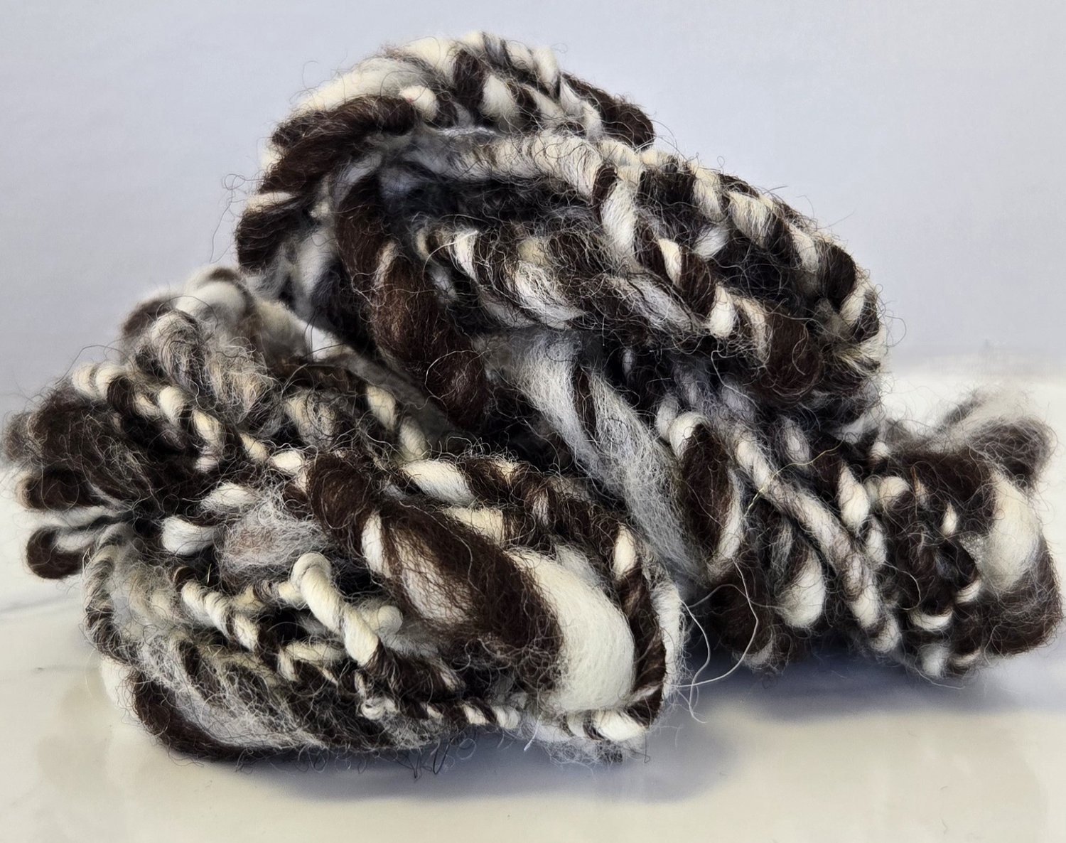 dark brown and white art yarn
