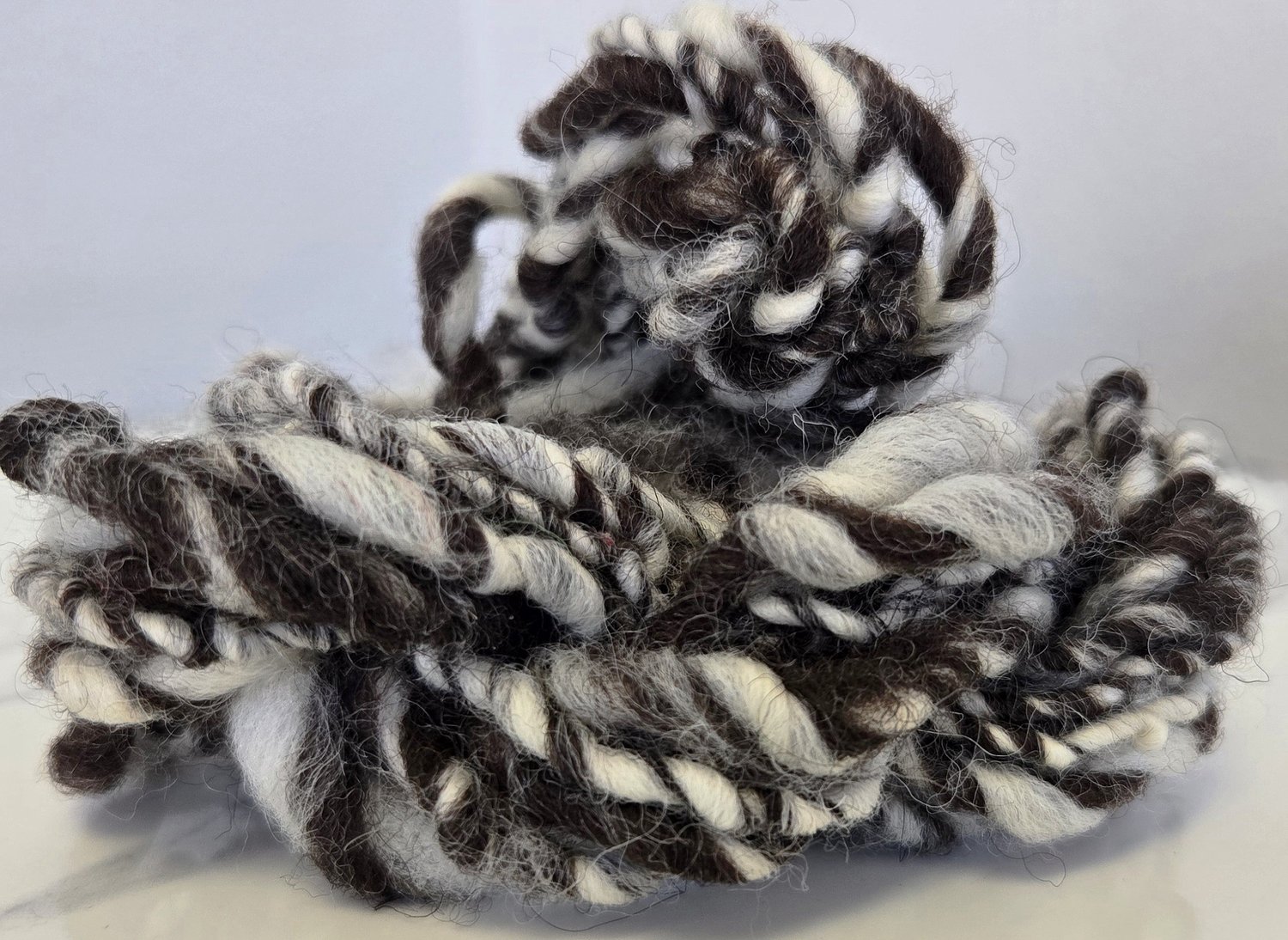 white and dark brown wool art yarn