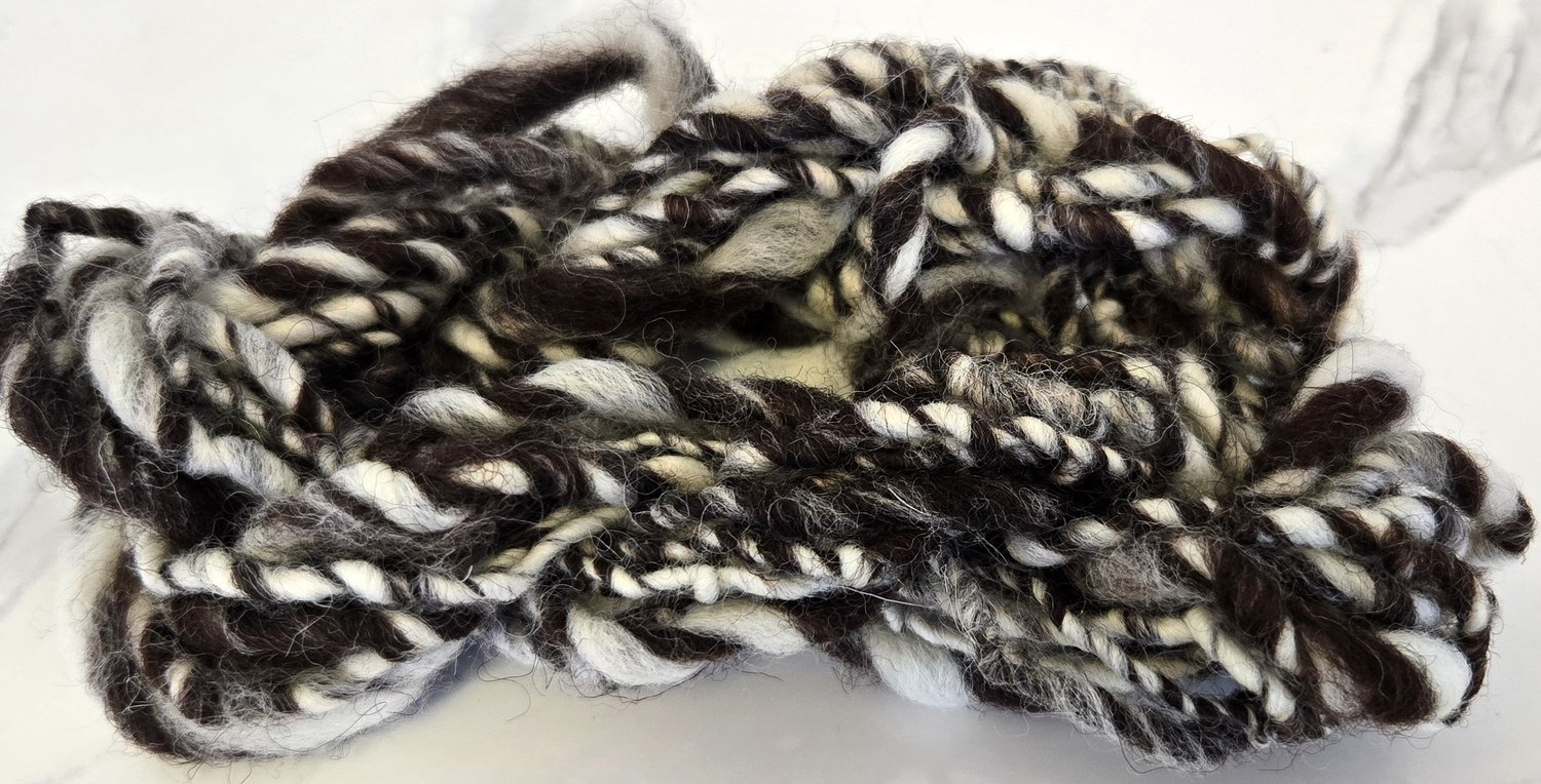 dark brown and white barber-pole wool art yarn