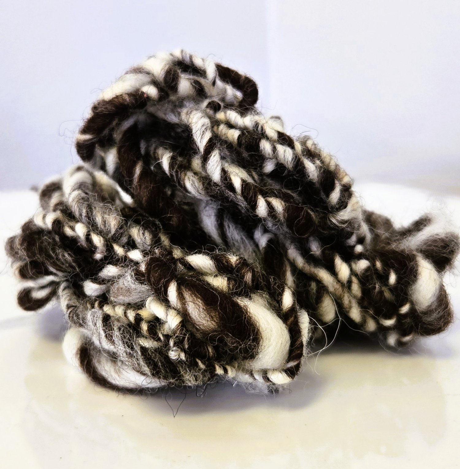 brown and white art yarn